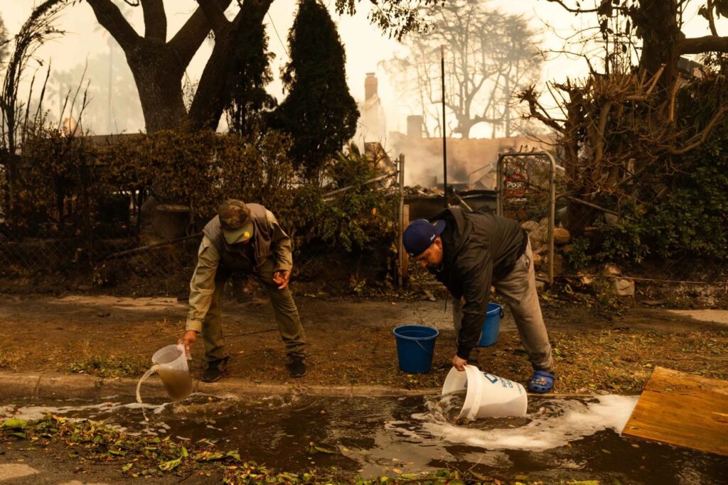 Altadena residents pour water onto neighbors' property.