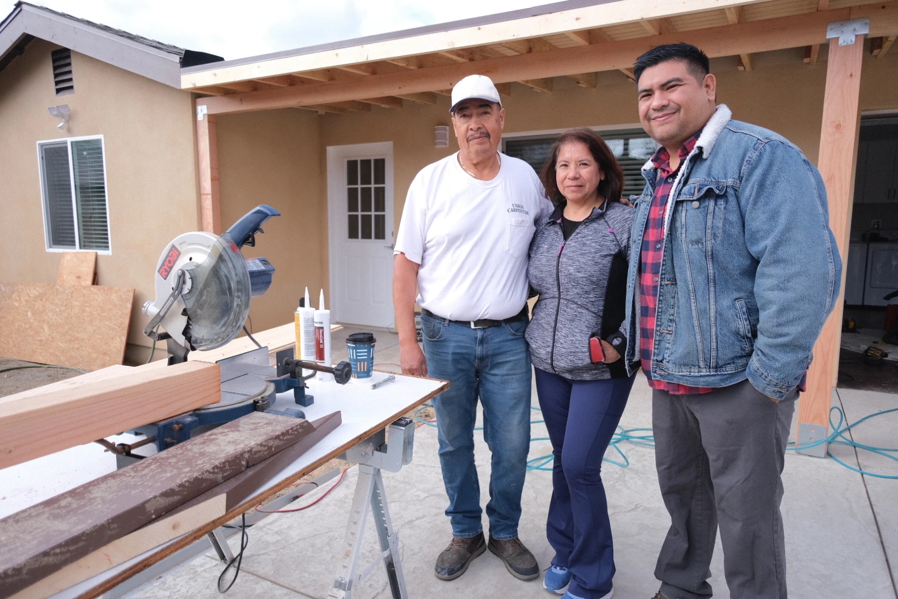 From left to right, Jose, Sandra and David Rodriguez stand outside their recently completed accessory dwelling unit in Altadena.